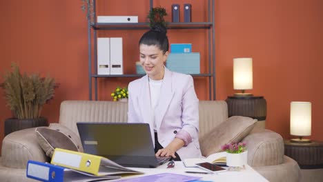 Home-office-worker-young-woman-attending-online-business-meeting.